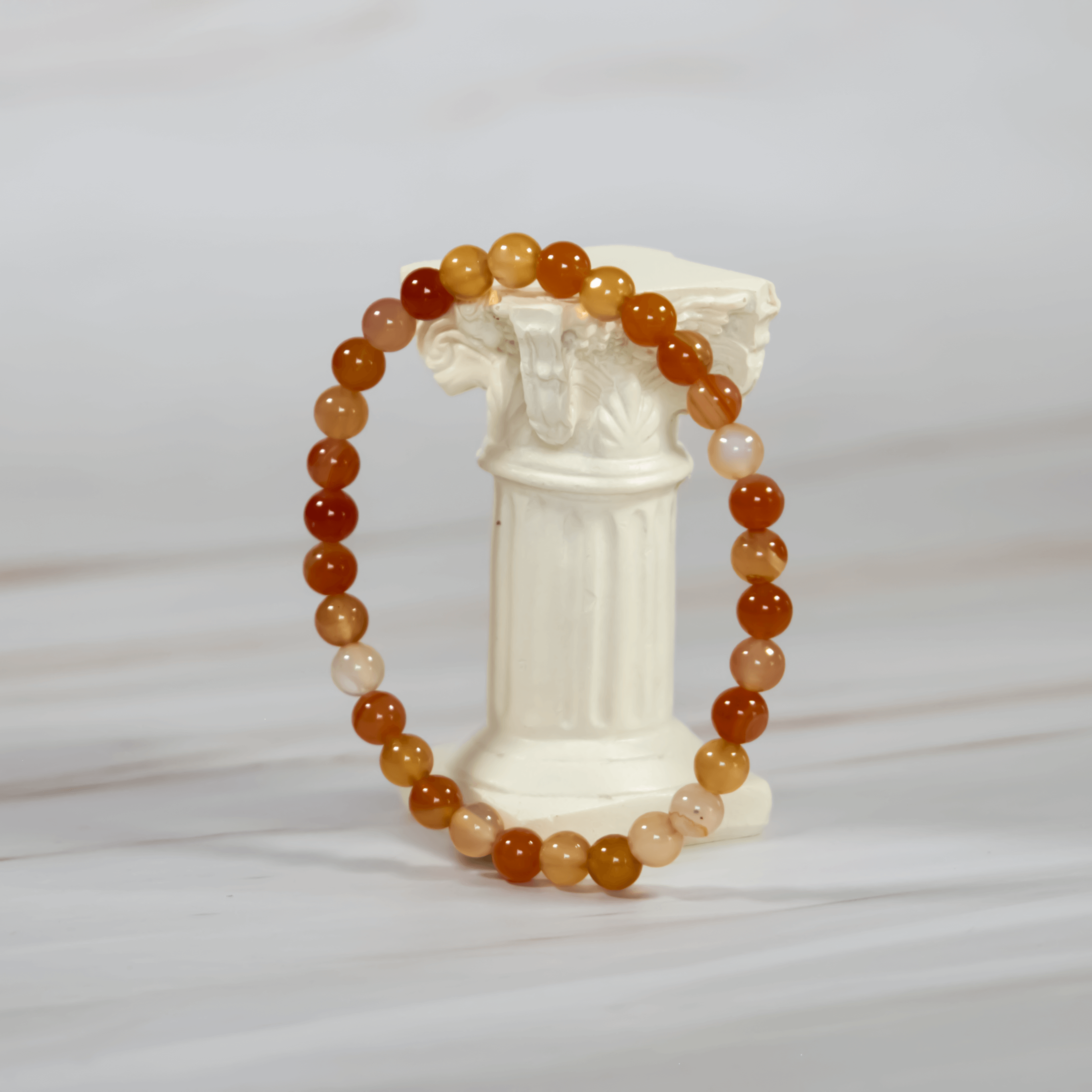 Karneol Edelstein Heilstein Armband Kristallschmuck Schmuck Schutzstein Astrologie Kristall für Sternzeichen Stier Widder Skorpion Krebs Geburtsstein für April Wirkung Chakra Sakralchakra Fruchtbarkeit Ausdauer Motivation Selbstbewusstsein Spiritualität Annurah Onlineshop Deutschland